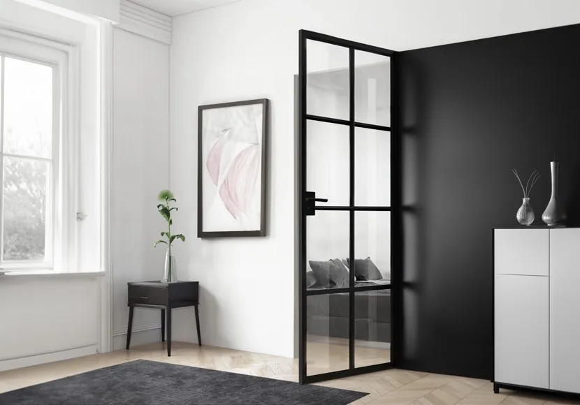 Schwarze LOFT-Drehtür aus Stahl mit Glas und Sprossenraster